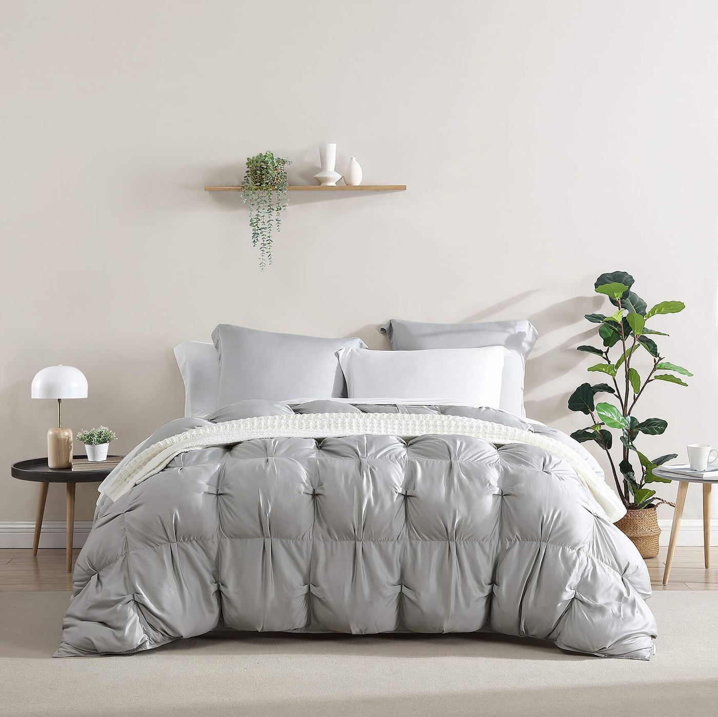 Moon grey comforter on a bed