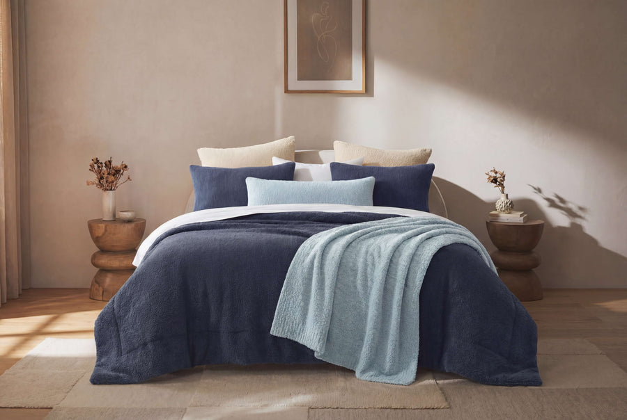 Sunday Citizen Snug Lumbar Pillow and Throw in Misty Blue on a bed