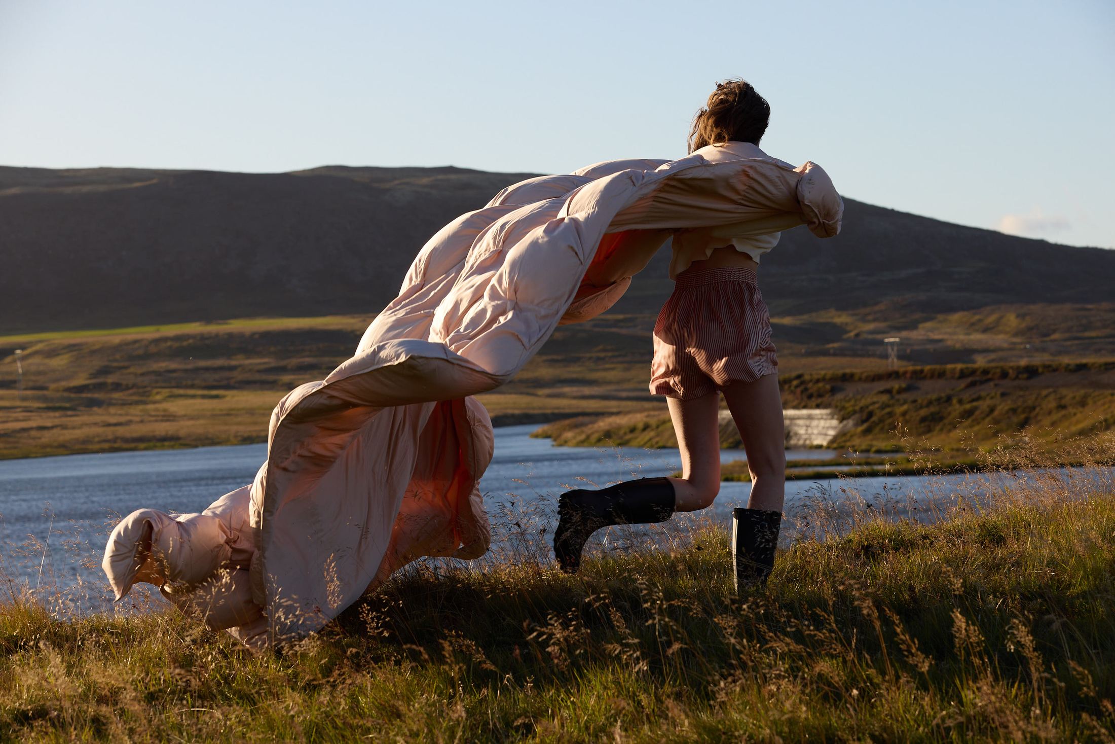 Woman running with the Sunday Citizen comforter outdoors